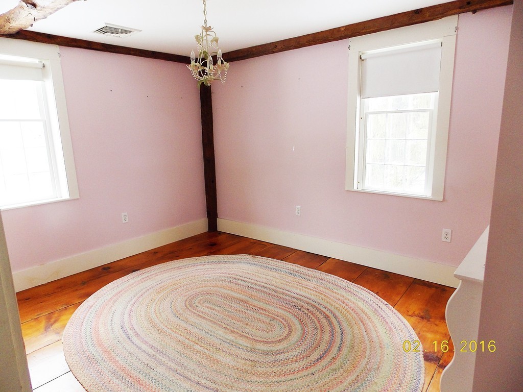 7 Wilder Lane Sterling, MA 01564 - Photo 11 of 21 a bedroom with a bed and a window
