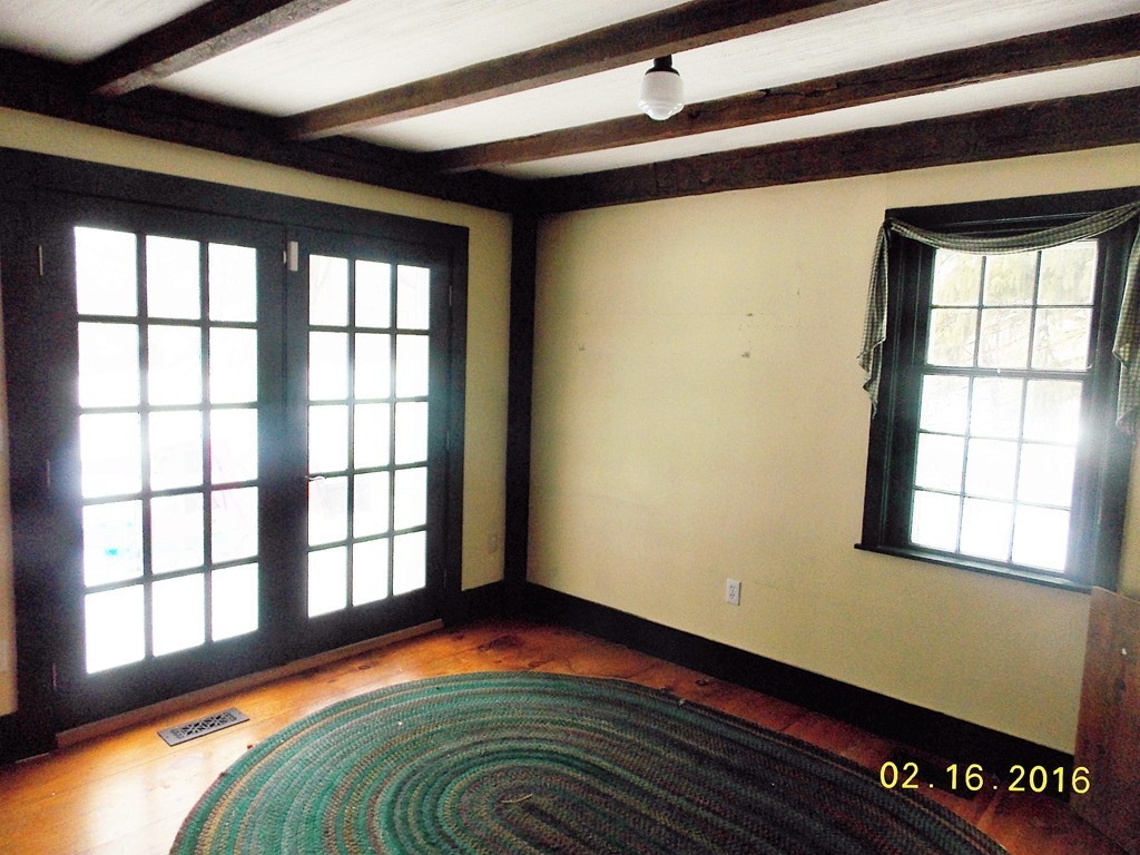 7 Wilder Lane Sterling, MA 01564 - Photo 12 of 21 a bed sitting in a bedroom next to a window