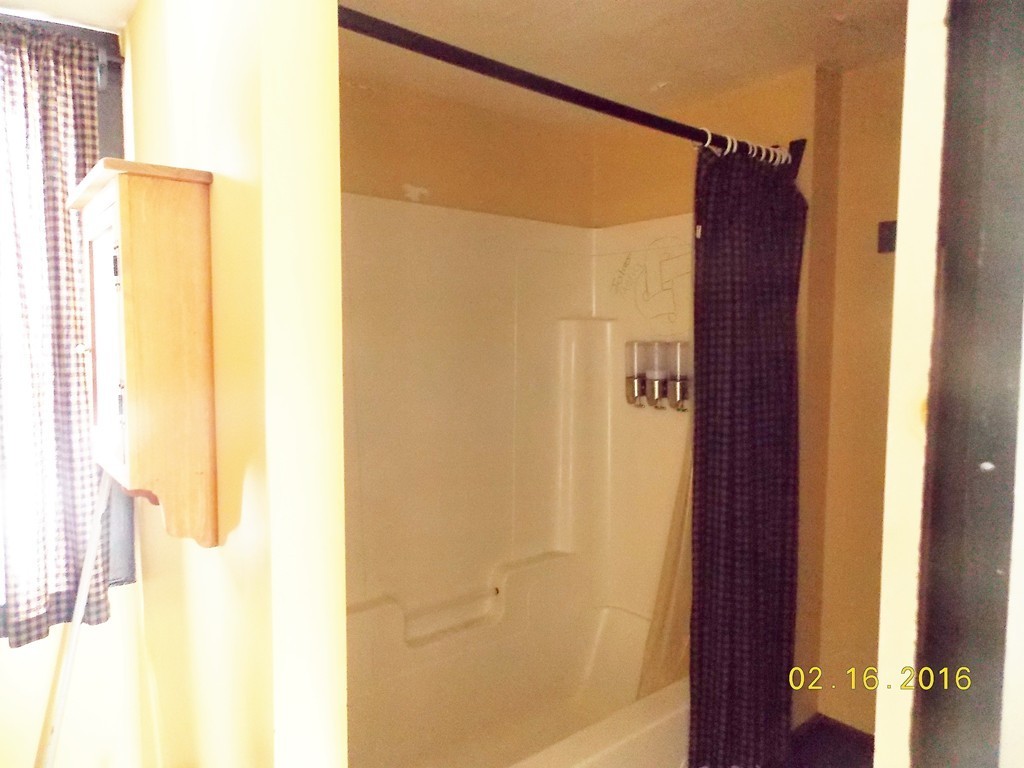 7 Wilder Lane Sterling, MA 01564 - Photo 13 of 21 a bathroom with a shower and a mirror