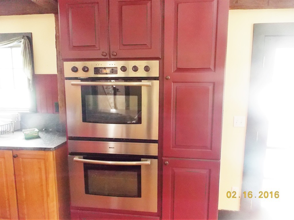 7 Wilder Lane Sterling, MA 01564 - Photo 4 of 21 a stove top oven sitting inside of a kitchen