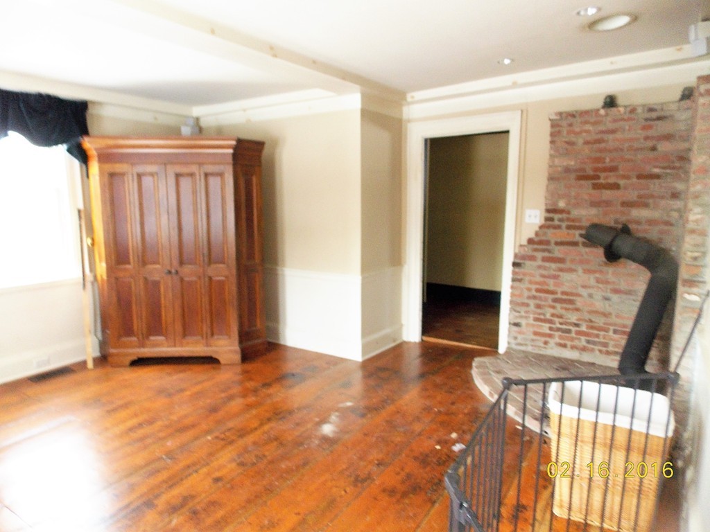 7 Wilder Lane Sterling, MA 01564 - Photo 9 of 21 a view of front door with wooden floor