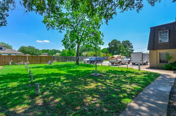 a view of yard with grass and a trees