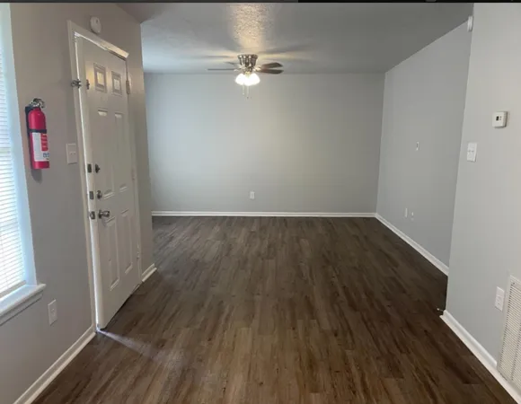 a view of a kitchen with wooden floor