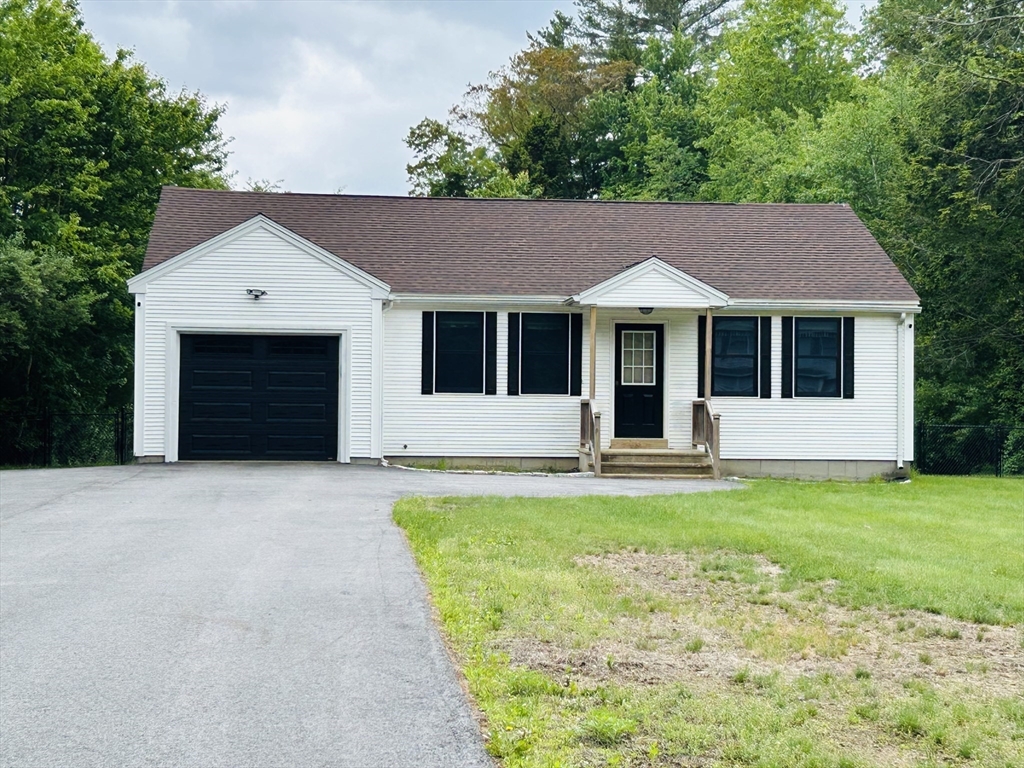 32 Sandy Pine Road Templeton, MA 01468 - Photo 1 of 30 a front view of a house with yard and garage