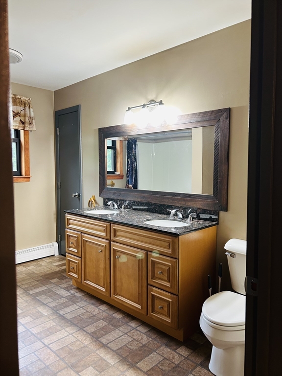 32 Sandy Pine Road Templeton, MA 01468 - Photo 17 of 30 a bathroom with a toilet a sink and a mirror
