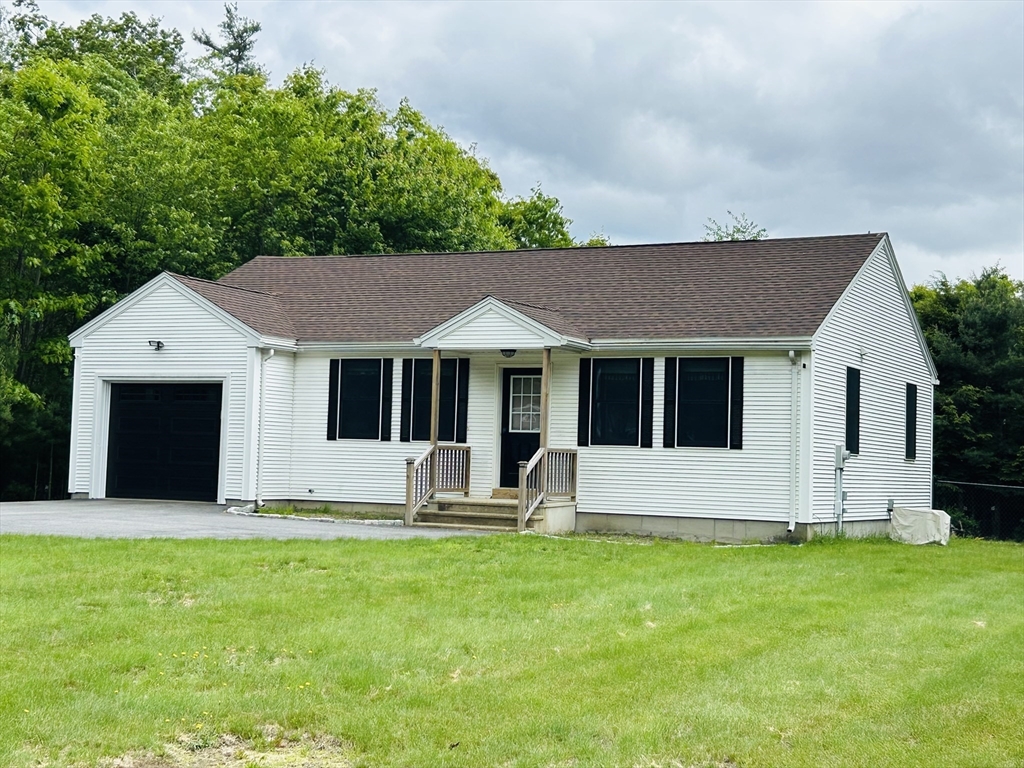 32 Sandy Pine Road Templeton, MA 01468 - Photo 3 of 30 a front view of house with yard and outdoor seating