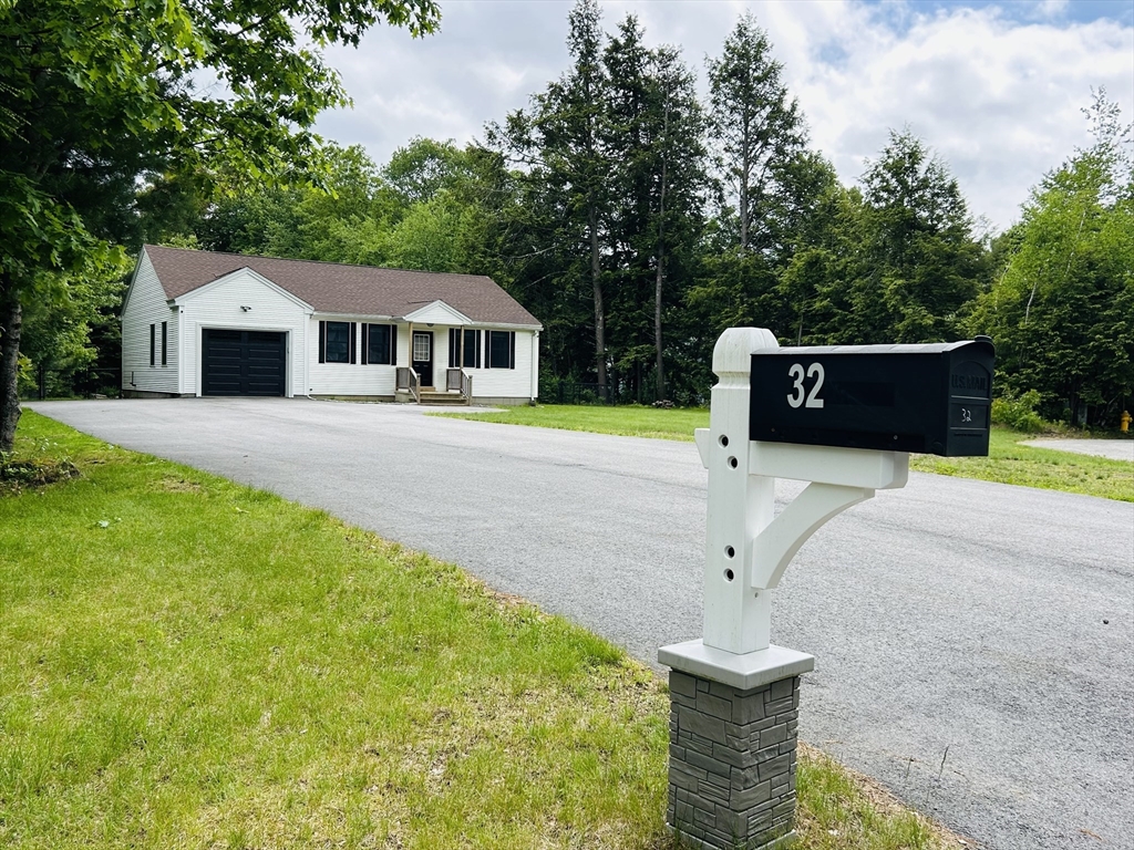 32 Sandy Pine Road Templeton, MA 01468 - Photo 4 of 30 a front view of a house with a yard and trees