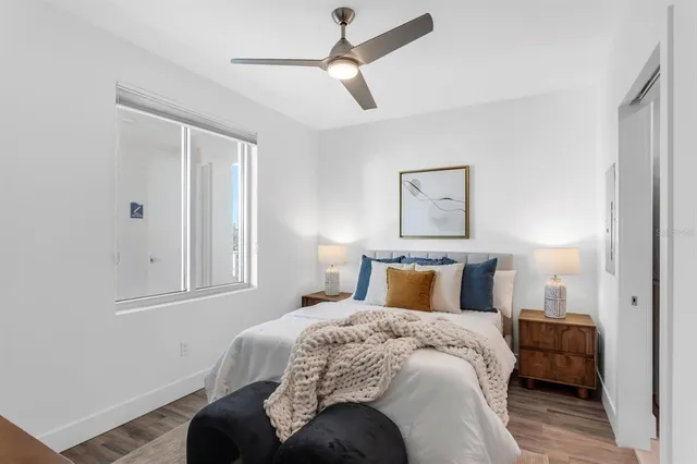 a bedroom with a bed and lamp