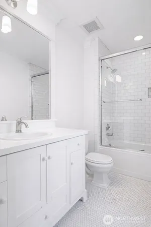 a bathroom with a sink a toilet and a bathtub