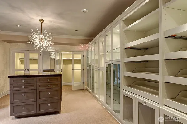 a room with pool table and windows