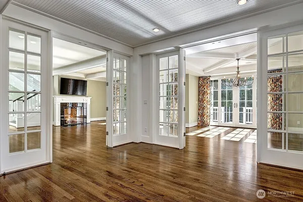 a kitchen with stainless steel appliances granite countertop a sink cabinets and wooden floor