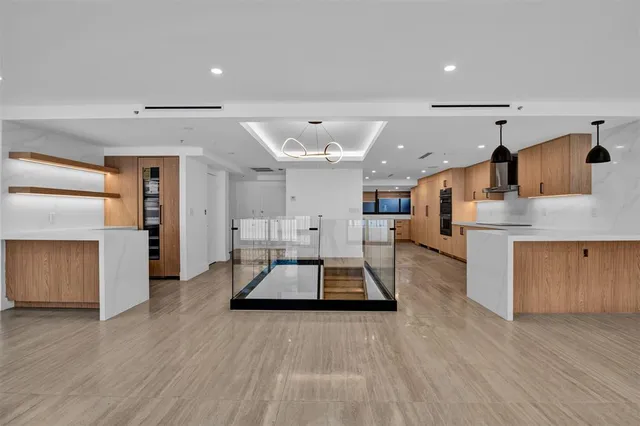 a view of kitchen with cabinets and wooden floor