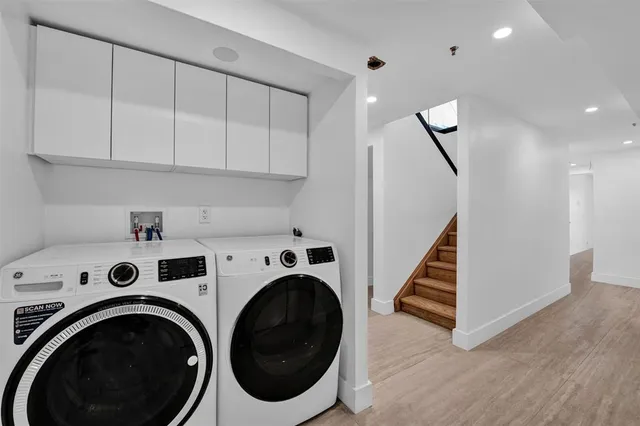 a view of hallway with washer and dryer
