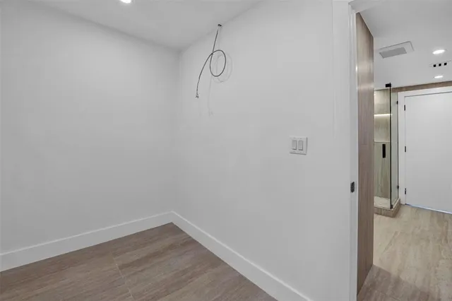 a view of small space with wooden floor