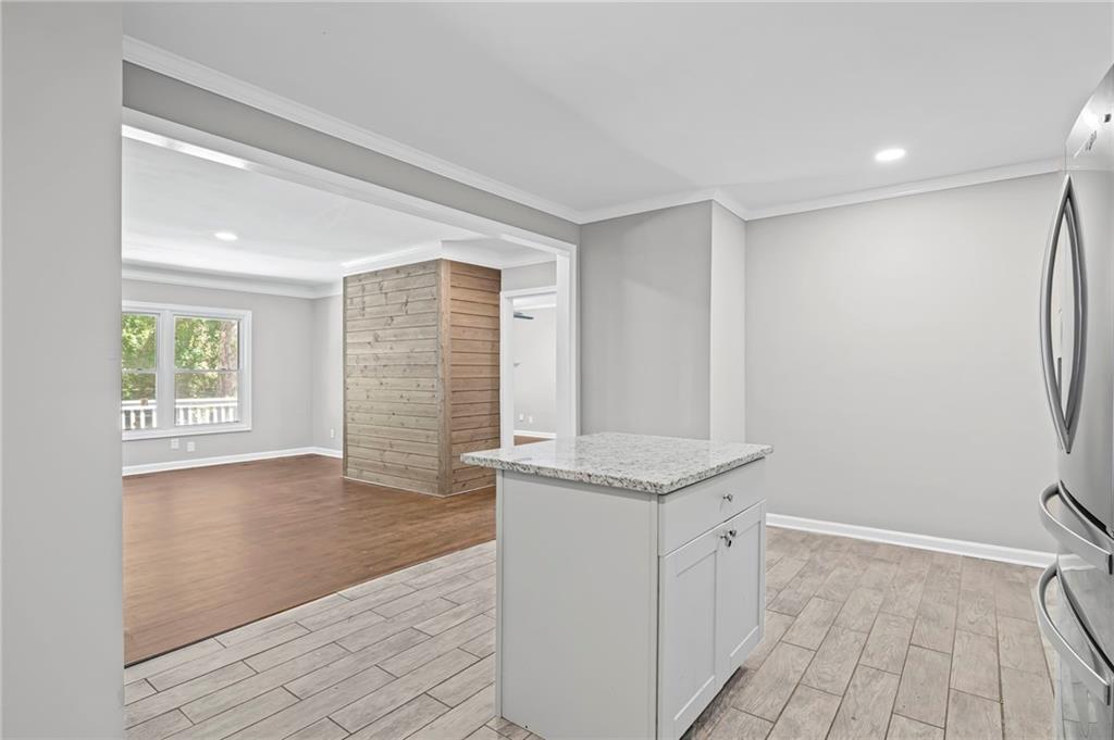 2790 Collier Drive Northwest Atlanta, GA 30318 - Photo 16 of 44 a view of a kitchen with a sink and dishwasher with wooden floor