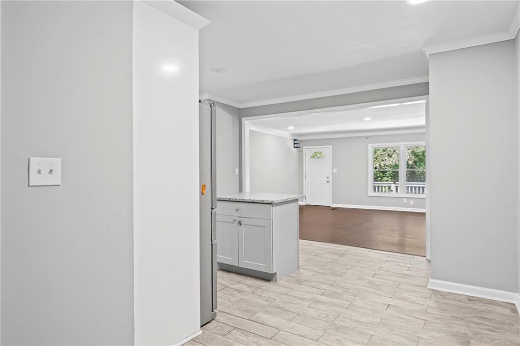 2790 Collier Drive Northwest Atlanta, GA 30318 - Photo 18 of 44 a view of an empty room with window and wooden floor