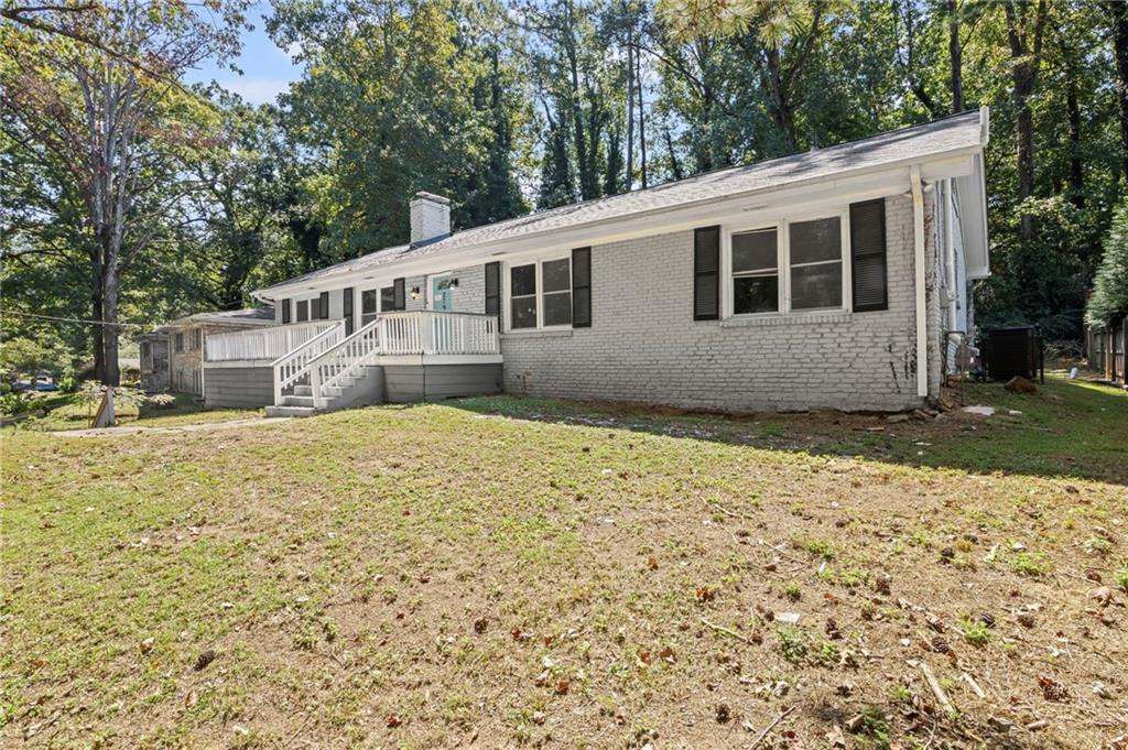 2790 Collier Drive Northwest Atlanta, GA 30318 - Photo 2 of 44 a house with trees in the background