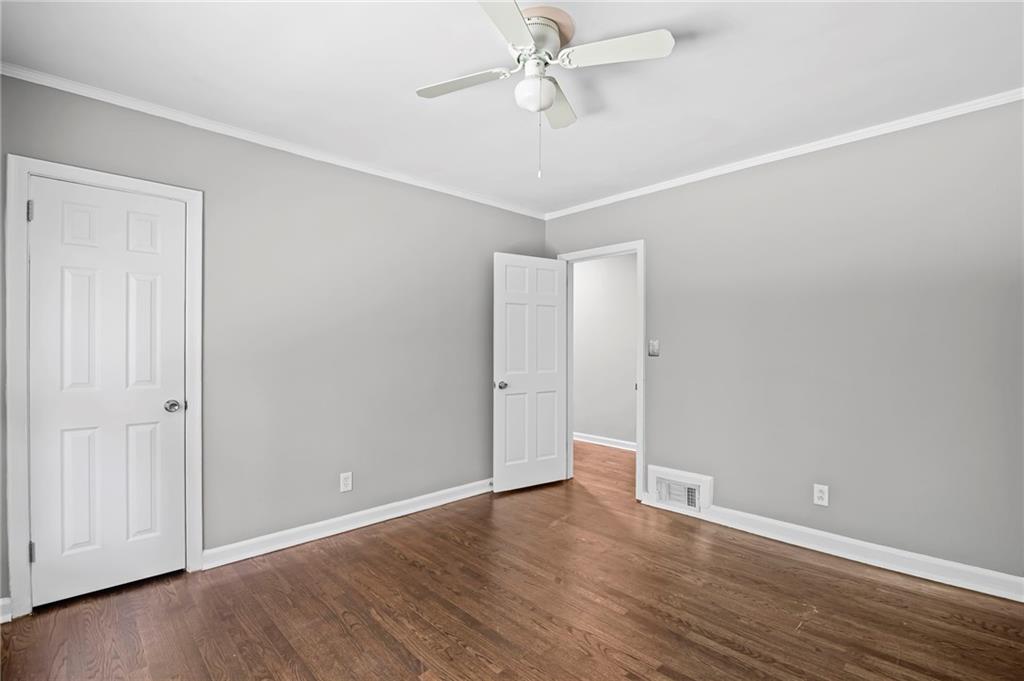 2790 Collier Drive Northwest Atlanta, GA 30318 - Photo 24 of 44 a view of an empty room with wooden floor