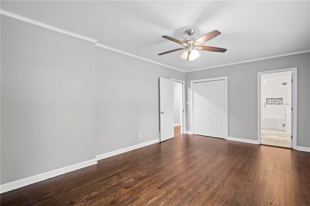 2790 Collier Drive Northwest Atlanta, GA 30318 - Photo 27 of 44 a view of an empty room with window and wooden floor