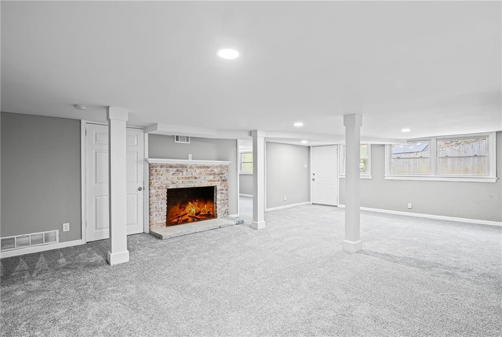 2790 Collier Drive Northwest Atlanta, GA 30318 - Photo 30 of 44 a view of a room with a fireplace cabinet and window