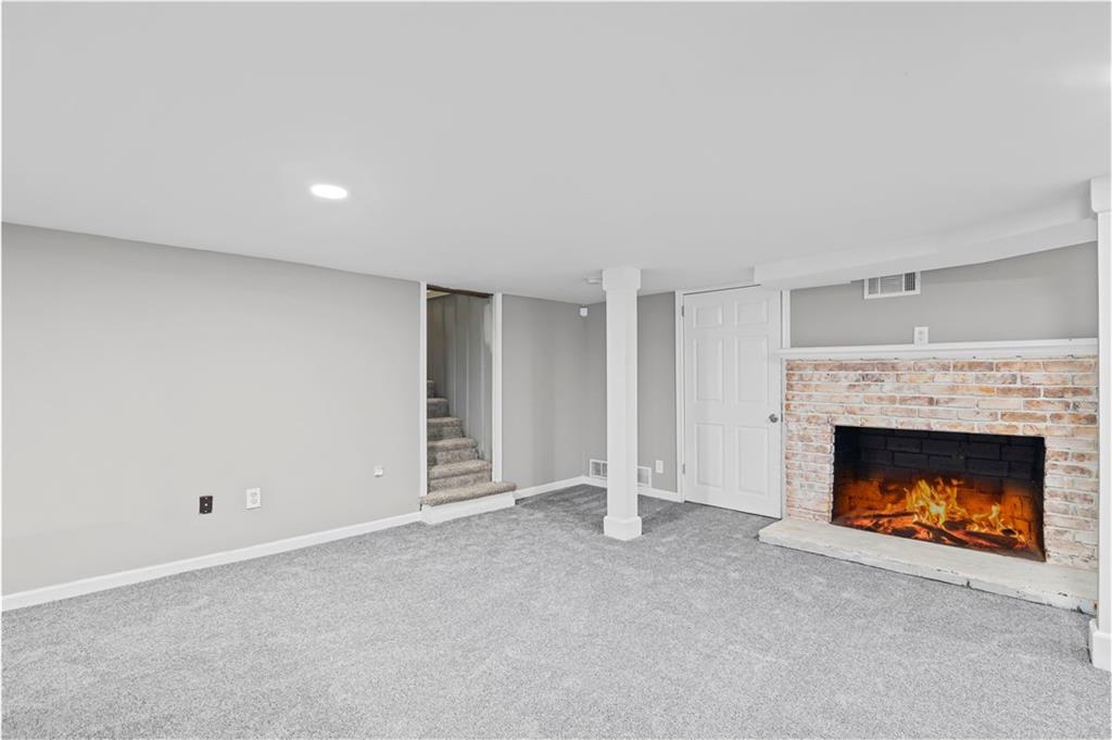 2790 Collier Drive Northwest Atlanta, GA 30318 - Photo 31 of 44 a view of an empty room with a fireplace