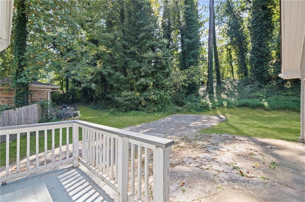 2790 Collier Drive Northwest Atlanta, GA 30318 - Photo 40 of 44 a view of a wooden deck and a yard with swimming pool