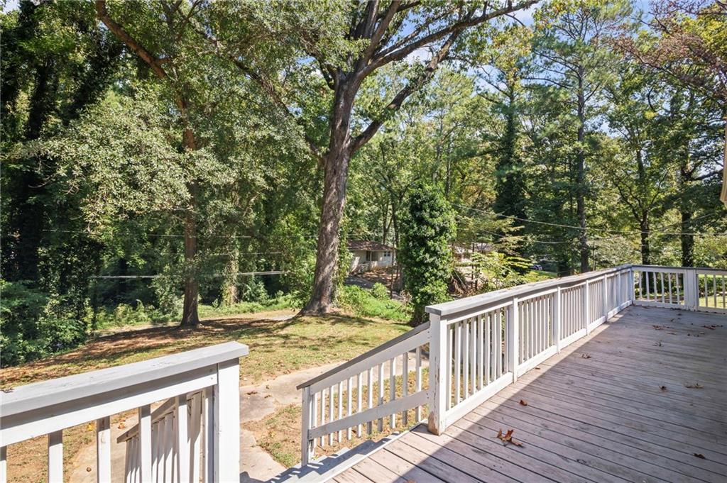 2790 Collier Drive Northwest Atlanta, GA 30318 - Photo 41 of 44 a view of balcony with wooden floor and fence