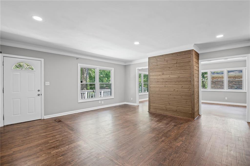 2790 Collier Drive Northwest Atlanta, GA 30318 - Photo 6 of 44 an empty room with wooden floor and windows