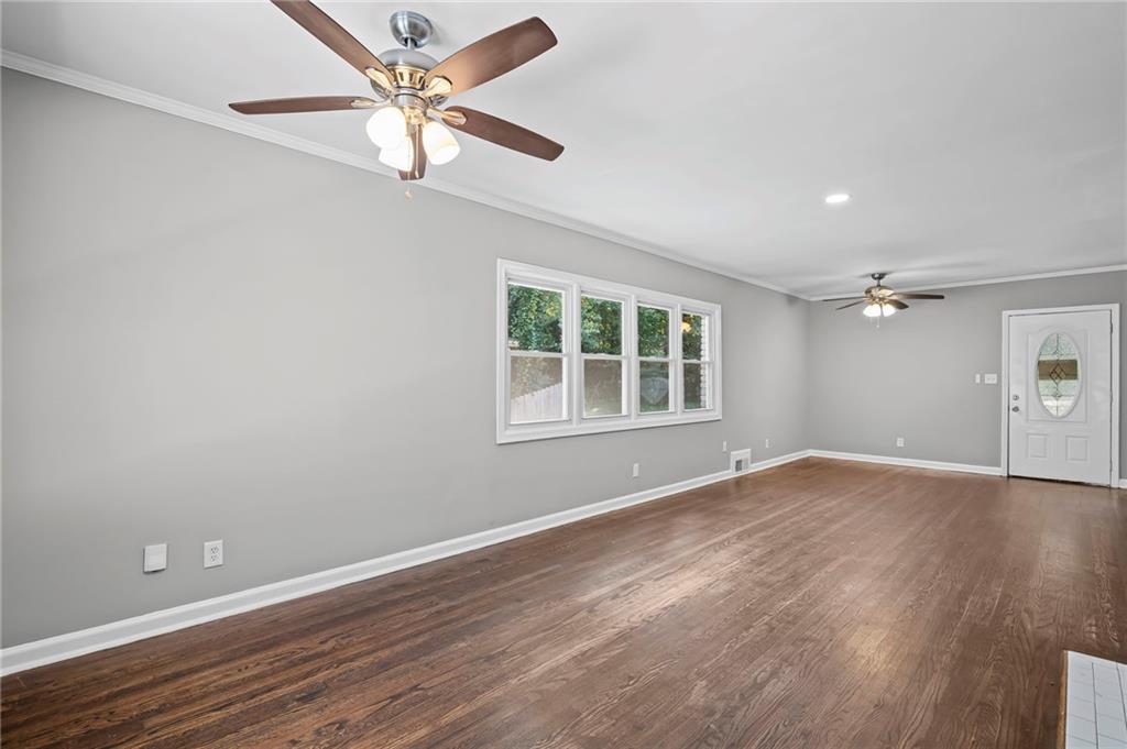 2790 Collier Drive Northwest Atlanta, GA 30318 - Photo 8 of 44 wooden floor in an empty room with a window