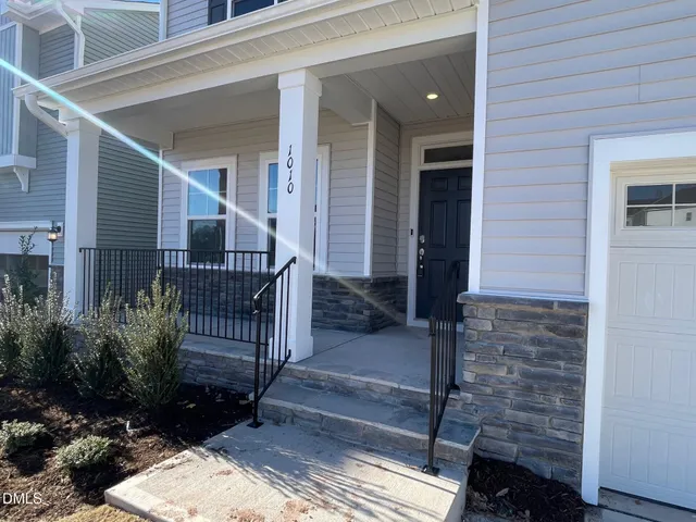 a view of house with wooden floor and a potted plant