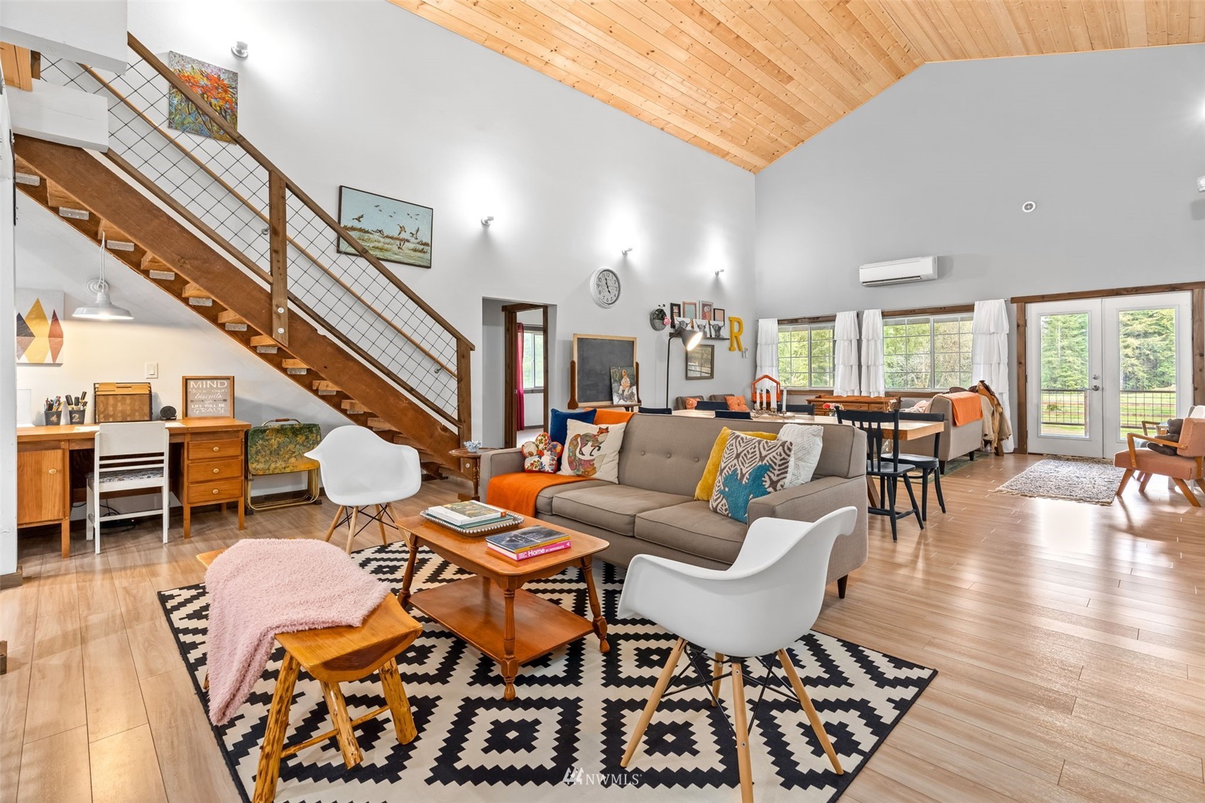 154 Rogerson Road Chehalis, WA 98532 - Photo 12 of 40 a living room with lots of furniture and a dining table with wooden floor