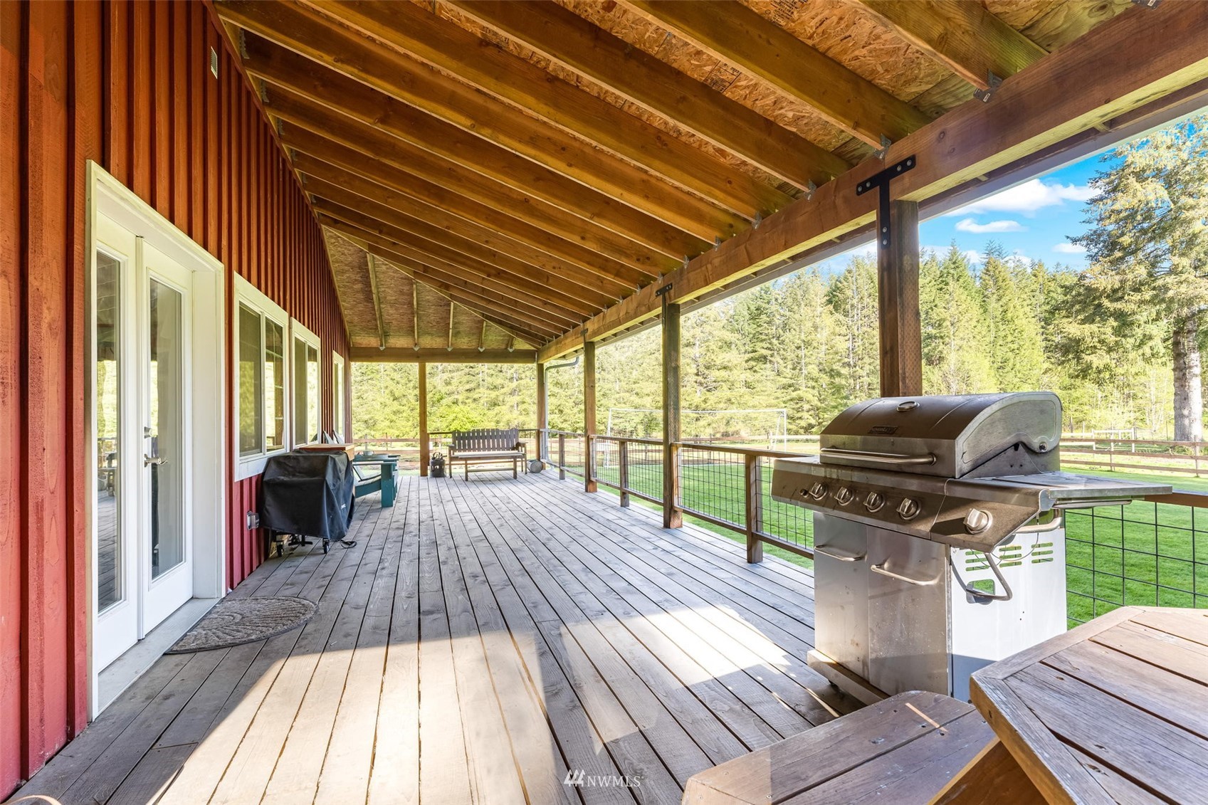 154 Rogerson Road Chehalis, WA 98532 - Photo 29 of 40 a view of a patio with table and chairs and wooden floor