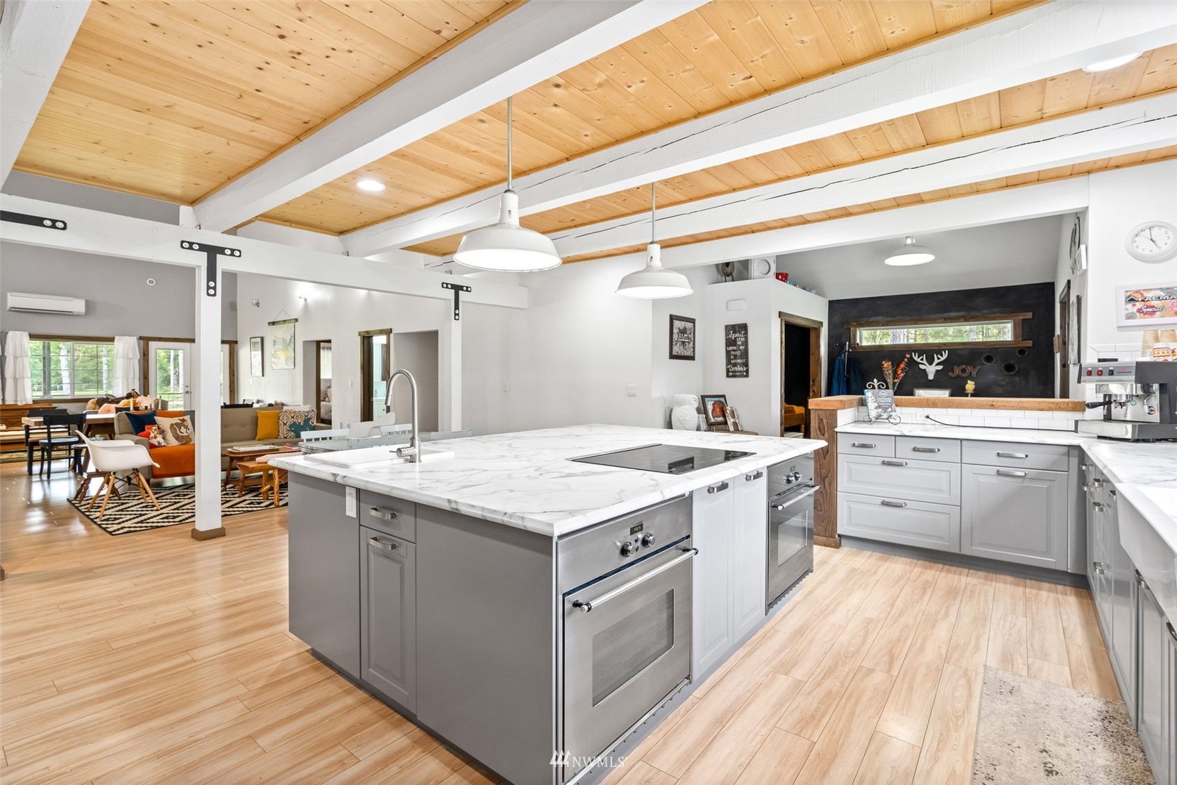 154 Rogerson Road Chehalis, WA 98532 - Photo 10 of 40 a large kitchen with a lot of counter space and wooden floor