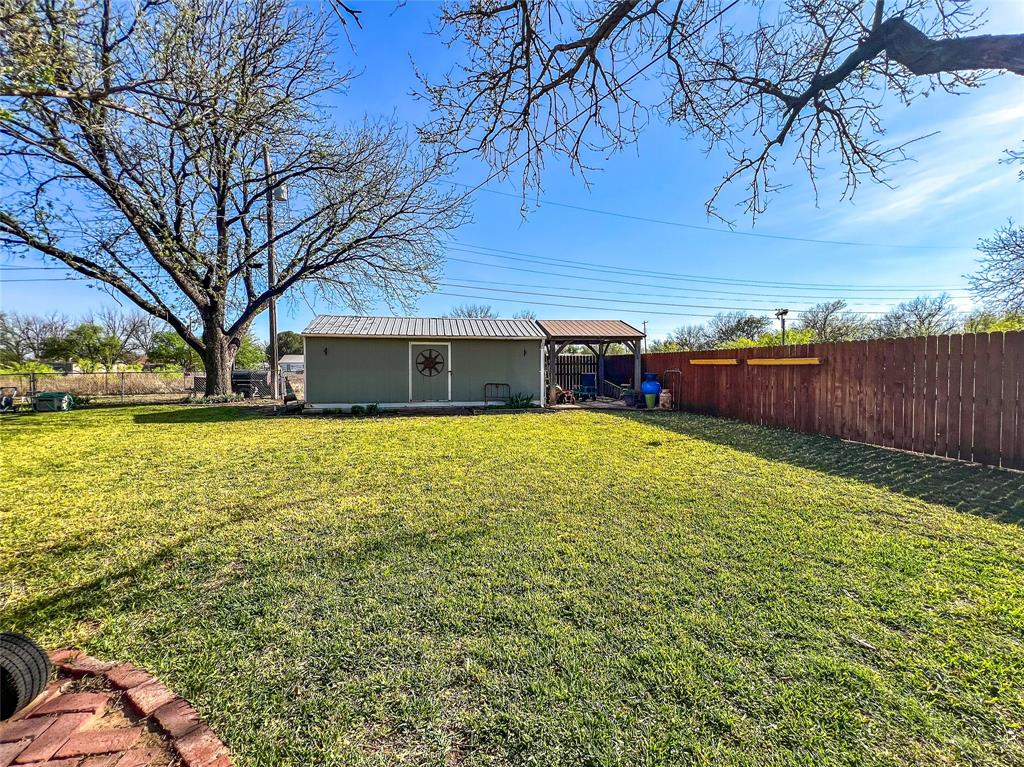 1009 North 7th Street Haskell, TX 79521 - Photo 24 of 26 a view of a house with a yard