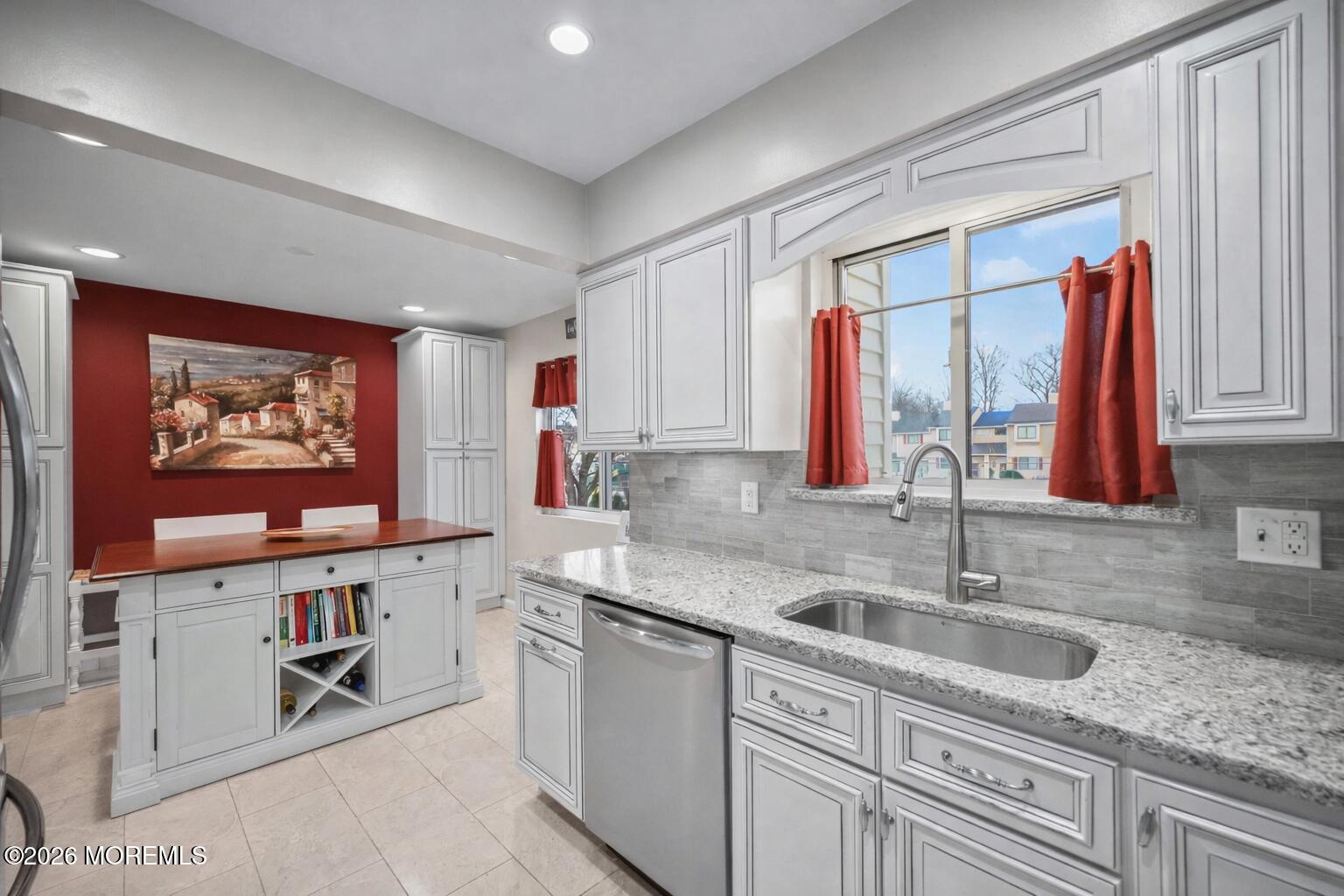 316 Middlewood Road Middletown, NJ 07748 - Photo 16 of 33 a kitchen with stainless steel appliances granite countertop a sink and a microwave