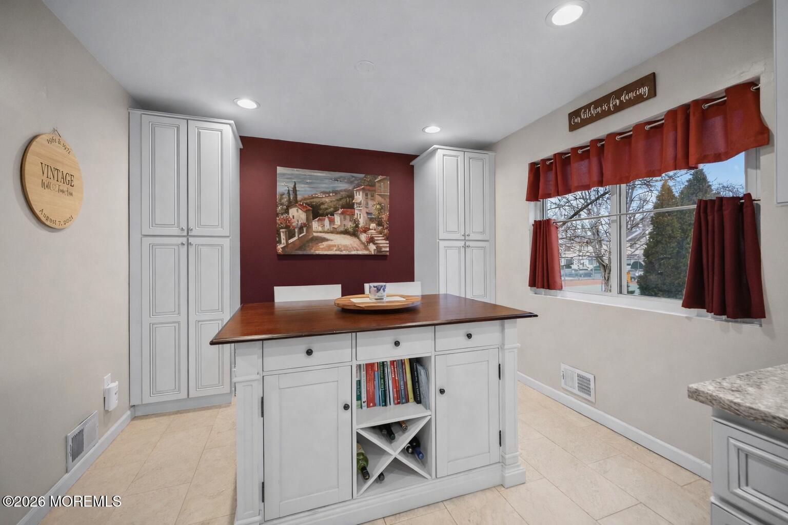 316 Middlewood Road Middletown, NJ 07748 - Photo 17 of 33 a hall with cabinets a window and a wooden floor