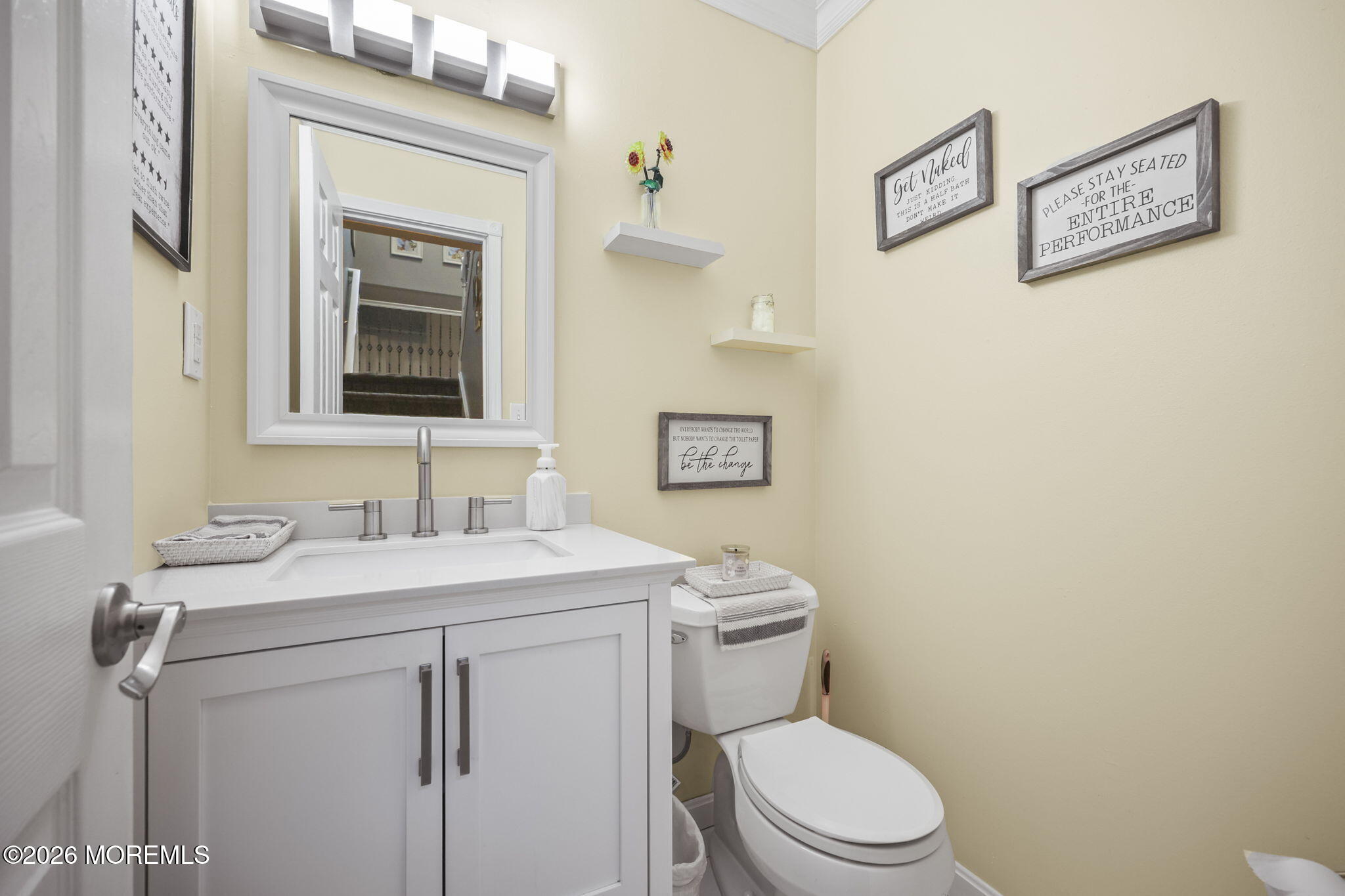 316 Middlewood Road Middletown, NJ 07748 - Photo 18 of 33 a bathroom with a toilet sink vanity and mirror