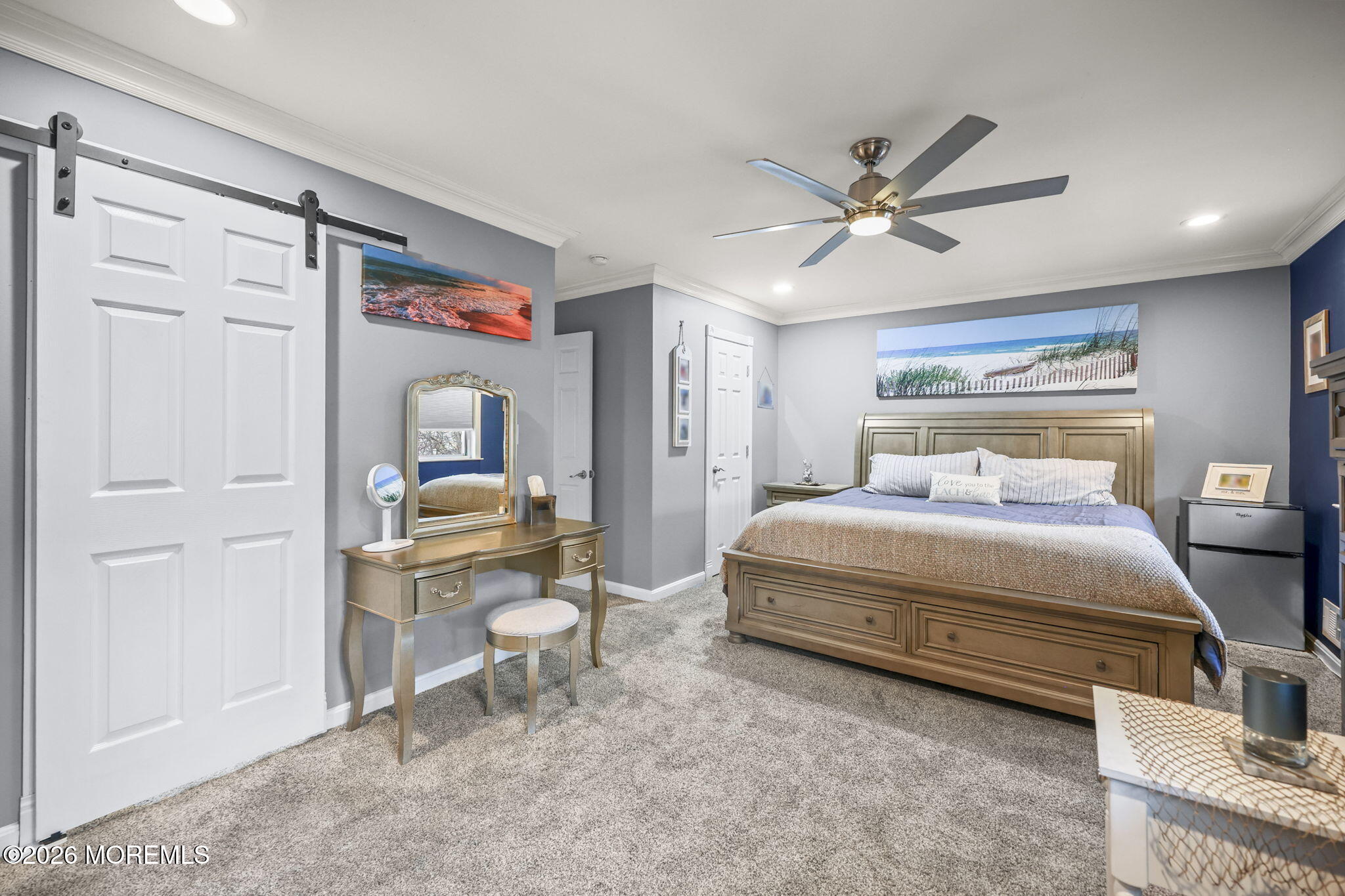 316 Middlewood Road Middletown, NJ 07748 - Photo 26 of 33 a bedroom with a bed and a chandelier