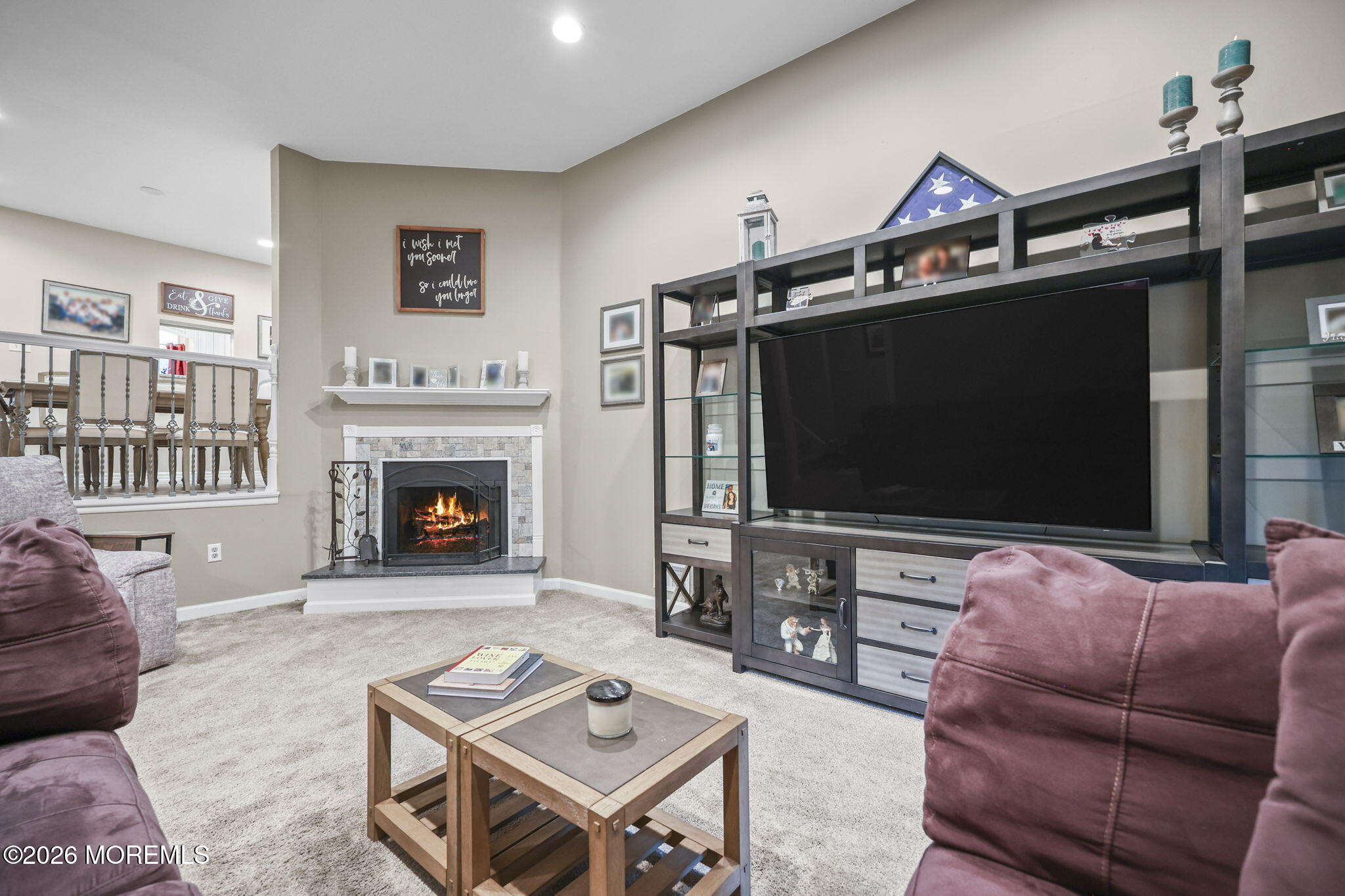 316 Middlewood Road Middletown, NJ 07748 - Photo 7 of 33 a living room with furniture a flat screen tv and a table