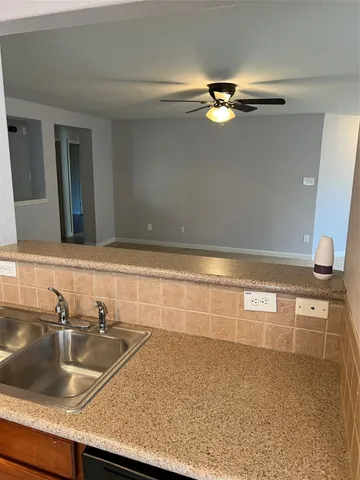 a bathroom with a sink a vanity and a mirror