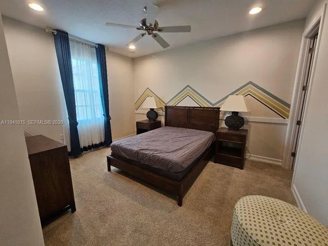 a bedroom with a bed and a walk in closet