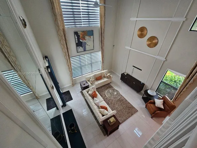 wooden floor with windows and white walls