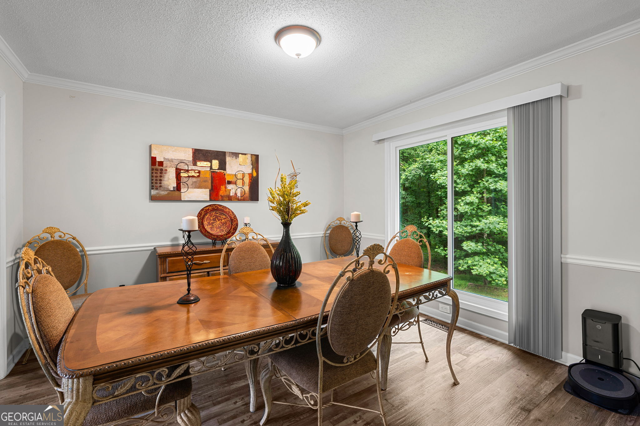 375 Gaelic Way Tyrone, GA 30290 - Photo 10 of 54 a view of a dining room with furniture and wooden floor