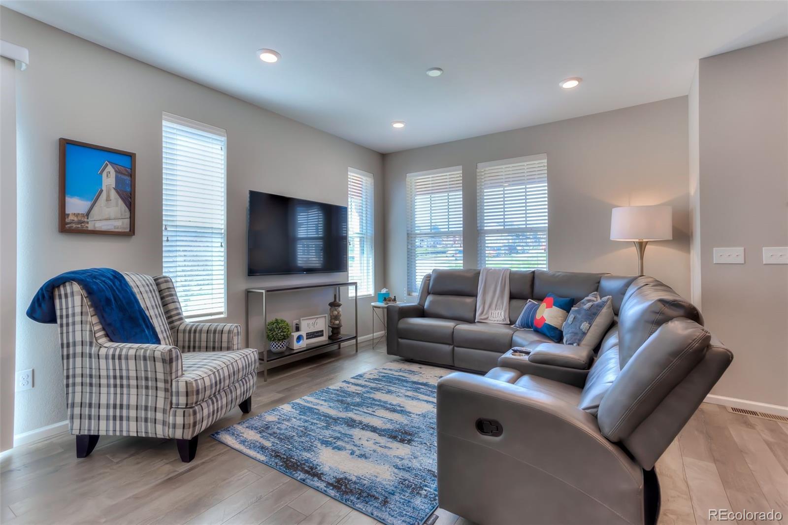 3550 Fennel Street Castle Rock, CO 80109 - Photo 11 of 37 a living room with furniture and a flat screen tv