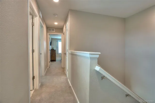 a view of hallway with stairs