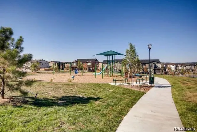 a view of a house with backyard porch and sitting area
