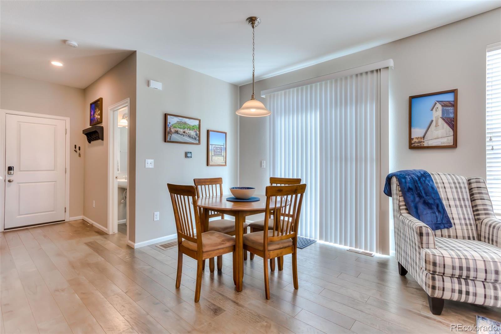 3550 Fennel Street Castle Rock, CO 80109 - Photo 10 of 37 a view of a dining room with furniture window and wooden floor