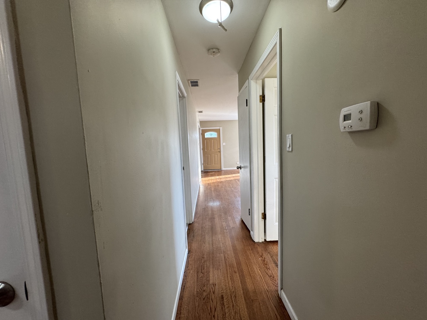 7838 West 73rd Place Bridgeview, IL 60455 - Photo 11 of 22 a view of a hallway with wooden floor