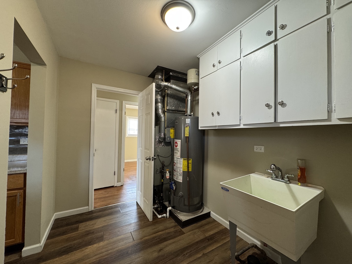 7838 West 73rd Place Bridgeview, IL 60455 - Photo 16 of 22 a view of a storage and utility room with wooden floor