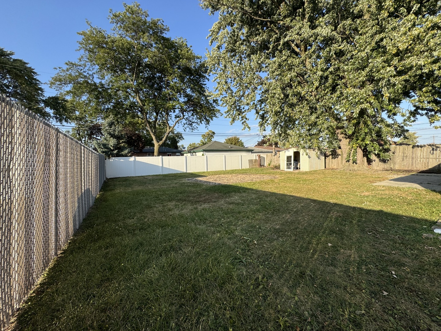 7838 West 73rd Place Bridgeview, IL 60455 - Photo 18 of 22 a view of yard with large trees and plants